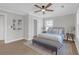 Serene main bedroom offers hardwood floors, a ceiling fan, and modern décor at 3235 Bluebird Ln, Decatur, GA 30032