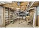 This unfinished basement has exposed beams, shelving, and duct work at 4676 Ridgewood Dr, Forest Park, GA 30297