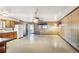 Open-concept kitchen area with wood cabinets and vintage light fixtures in a spacious layout at 4676 Ridgewood Dr, Forest Park, GA 30297