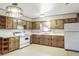 This kitchen features natural wood cabinets and a vintage aesthetic at 4676 Ridgewood Dr, Forest Park, GA 30297