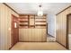 This living room has wood-paneled walls, an entrance and a built-in bookshelf at 4676 Ridgewood Dr, Forest Park, GA 30297