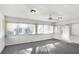This sunroom features many windows and a ceiling fan at 4676 Ridgewood Dr, Forest Park, GA 30297