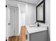 Bright bathroom featuring a modern vanity with a black faucet and framed mirror at 1150 Rankin St # 6H, Stone Mountain, GA 30083