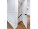 Hallway with staircase, hardwood floors, and door to living space at 1150 Rankin St # 6H, Stone Mountain, GA 30083