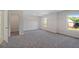 Bedroom with carpet, windows and walk-in closet at 206 Lotus Ln, Covington, GA 30016