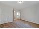 Neutral bedroom with carpet, white trim and doors, and access to more rooms at 206 Lotus Ln, Covington, GA 30016