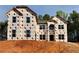 New home under construction showing windows and exterior wrapped with protective material at 206 Lotus Ln, Covington, GA 30016