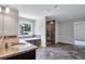Bathroom with walk-in shower, soaking tub, granite counters, and sink at 218 Lotus Ln, Covington, GA 30016