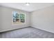 Bedroom with a large window allowing ample natural light at 218 Lotus Ln, Covington, GA 30016
