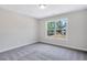 Bedroom with a large window allowing ample natural light at 218 Lotus Ln, Covington, GA 30016