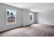 Walk-in closet with carpet and bright, natural light from double hung windows at 218 Lotus Ln, Covington, GA 30016