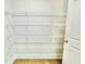 Walk-in pantry with white wire shelving, providing ample storage space at 218 Lotus Ln, Covington, GA 30016