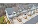 Aerial view of the townhomes showing landscaping, garages, and a partial view of a vehicle at 233 Retreat Ln, Canton, GA 30114