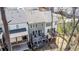 An aerial view of the home with an outdoor patio and deck area at 233 Retreat Ln, Canton, GA 30114
