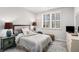 Inviting bedroom features a queen-size bed, plantation shutters, and neutral decor at 233 Retreat Ln, Canton, GA 30114