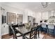 Elegant dining room with a dining table and chairs, designer lighting, and easy access to the kitchen at 233 Retreat Ln, Canton, GA 30114