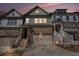 Charming townhome with well-maintained landscaping, a two-car garage, and inviting curb appeal at sunset at 233 Retreat Ln, Canton, GA 30114