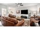 Comfortable living room features leather furniture, a large television, and a decorative area rug at 233 Retreat Ln, Canton, GA 30114