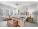 Serene main bedroom with a comfortable king-sized bed, neutral color scheme, and large windows, inviting natural light at 233 Retreat Ln, Canton, GA 30114