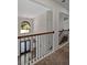 Elegant entryway featuring a chandelier, decorative glass front door, and wood and iron railing at 255 Lotus Ln, Covington, GA 30016