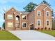 Beautiful two-story brick home featuring a manicured lawn, attached garage, and classic architectural details at 255 Lotus Ln, Covington, GA 30016