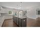 Well-equipped kitchen with granite countertops, stainless steel appliances, and a central island at 255 Lotus Ln, Covington, GA 30016