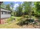Beautiful backyard featuring a small pond, rock features, and lush greenery, creating a serene outdoor space at 270 Piedmont Ne Rd, Marietta, GA 30066
