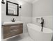 Modern bathroom featuring a freestanding tub and floating vanity with marble accents at 270 Piedmont Ne Rd, Marietta, GA 30066