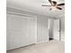 Bright bedroom featuring a ceiling fan, closet, and doorway at 270 Piedmont Ne Rd, Marietta, GA 30066
