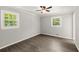 Bedroom with wood-look floors, gray walls, white trim, and two windows for plenty of natural light at 270 Piedmont Ne Rd, Marietta, GA 30066