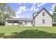 Back of house featuring a spacious lawn, crisp white siding and a screened in porch at 270 Piedmont Ne Rd, Marietta, GA 30066