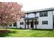 Two story home with white siding, dark shutters, and a well-maintained front lawn with a flowering tree at 270 Piedmont Ne Rd, Marietta, GA 30066