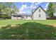 Backyard view of this charming two-story home featuring a well-manicured lawn and a peaceful, private setting at 270 Piedmont Ne Rd, Marietta, GA 30066