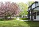 View of the home's front yard with a green lawn, walkway, and a flowering tree, with a partial view of the house at 270 Piedmont Ne Rd, Marietta, GA 30066