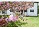 Close-up view of a flowering tree with a partial view of the home's exterior and front lawn at 270 Piedmont Ne Rd, Marietta, GA 30066