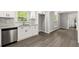 Kitchen with stainless steel dishwasher, white cabinets, and granite countertops at 270 Piedmont Ne Rd, Marietta, GA 30066
