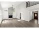 Spacious living room with vaulted ceilings, a stone fireplace, wood-look flooring, and ample natural light at 270 Piedmont Ne Rd, Marietta, GA 30066