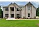 Beautiful two-story brick home with lush green lawn and classic architectural design at 221 Lotus Ln, Covington, GA 30016