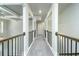 Upstairs hallway with high ceilings and decorative railing at 221 Lotus Ln, Covington, GA 30016