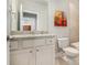 Bathroom with white vanity, granite countertop, a large mirror and tiled shower at 2402 Palladian Manor Se Way # 3, Atlanta, GA 30339