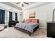 Cozy bedroom with carpeted floors, tray ceiling and dark window drapes at 2402 Palladian Manor Se Way # 3, Atlanta, GA 30339
