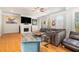 Sunlit living room features hardwood flooring, fireplace, and refined furniture at 2402 Palladian Manor Se Way # 3, Atlanta, GA 30339