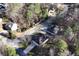Aerial view highlighting the home's proximity to the road, landscaping, and surrounding neighborhood at 3920 Vine Gate Dr, Lithonia, GA 30038