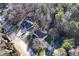 Aerial view of the property showcasing its location, mature trees, and quiet street at 3920 Vine Gate Dr, Lithonia, GA 30038