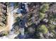 Overhead aerial view featuring the home's layout, driveway, and lush greenery bordering the property at 3920 Vine Gate Dr, Lithonia, GA 30038