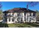 Expansive back exterior featuring a spacious yard, patio area, and classic siding at 3920 Vine Gate Dr, Lithonia, GA 30038