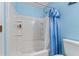 Bathroom featuring shower/tub combination with tiled surround and built in storage at 3920 Vine Gate Dr, Lithonia, GA 30038