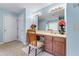 Charming bathroom vanity with spacious countertop, ample cabinets and a large mirror at 3920 Vine Gate Dr, Lithonia, GA 30038