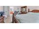 View of a bedroom with natural light, showcasing traditional furnishings and carpet flooring at 3920 Vine Gate Dr, Lithonia, GA 30038