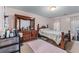Cozy bedroom featuring neutral walls, carpet flooring, and traditional wooden furniture at 3920 Vine Gate Dr, Lithonia, GA 30038